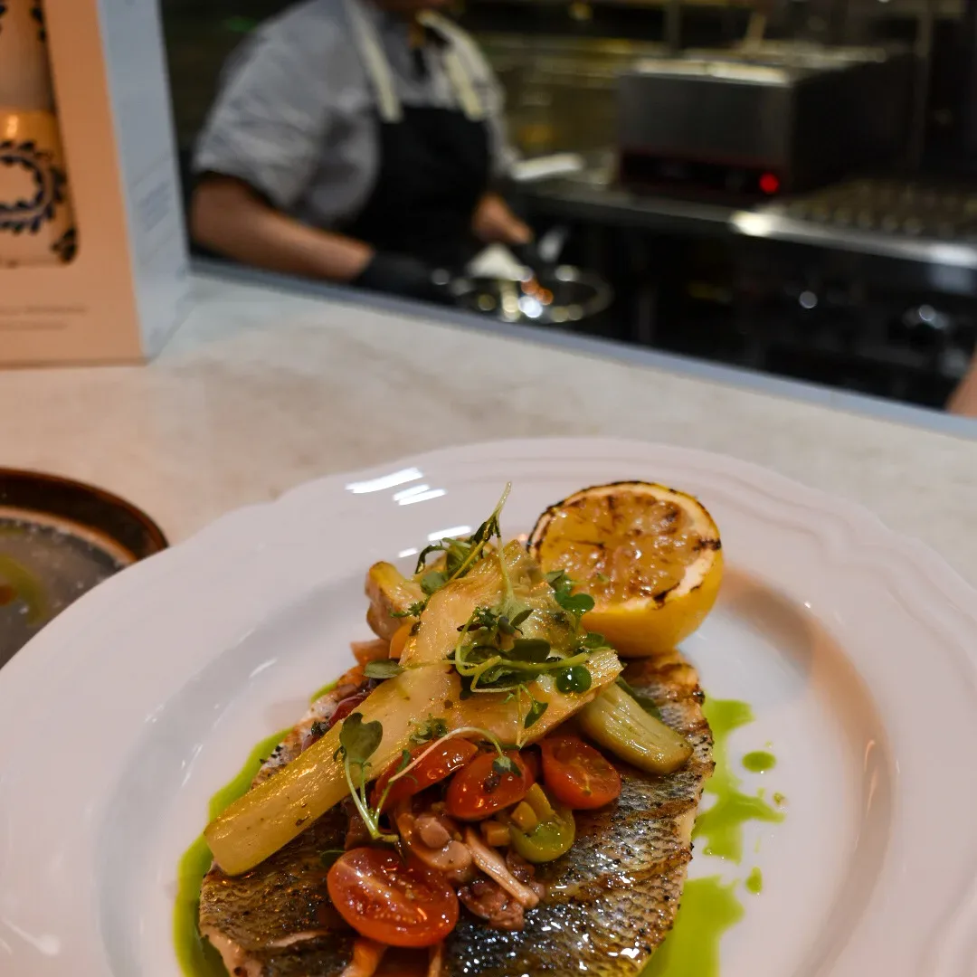 The line, mid-service, with tonight's branzino on the pass