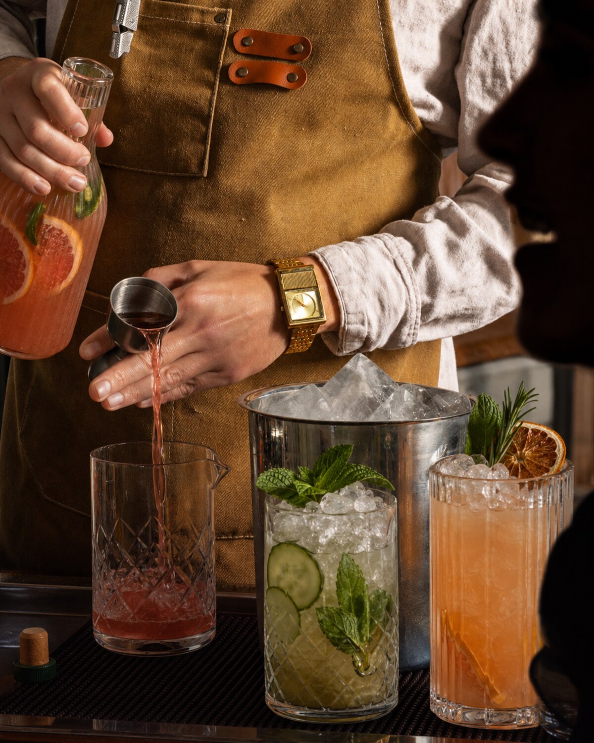 A bartender pouring at the cart