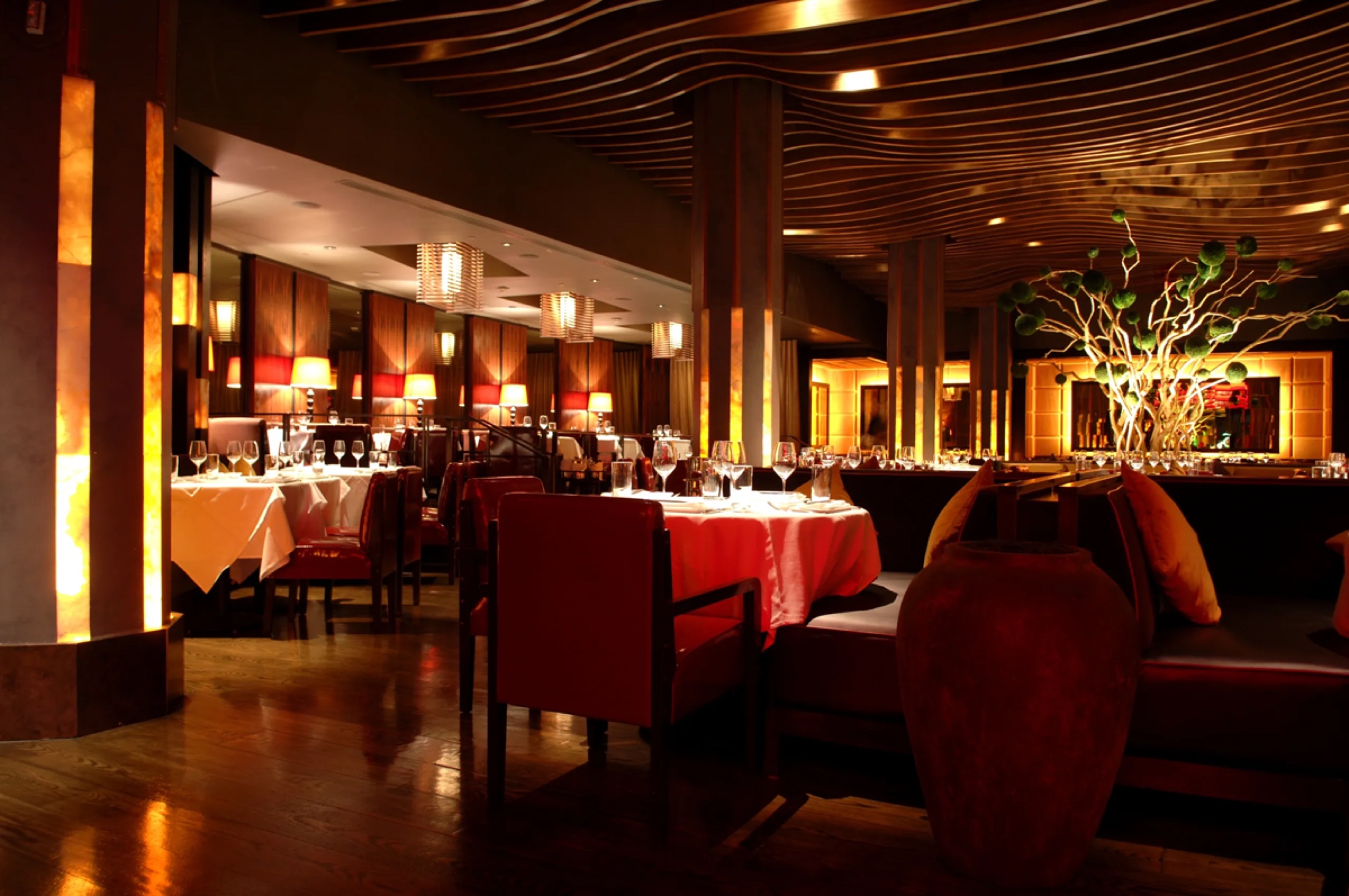 The Gourmand dining room at night, dressed for service